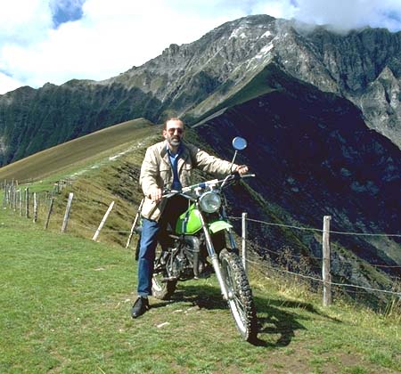 Ralph Walker on Trail Bike in Switzerland, with second photo in background which can be viewed in Netscape but not in Internet Explorer